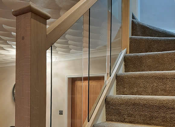 example of an oak and glass staircase makeover in Worsley